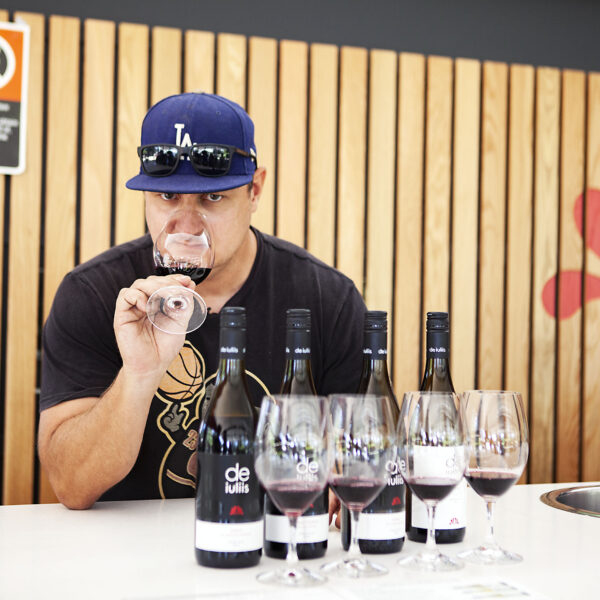 Winemaker Mike De Iuliis samples red shiraz wine
