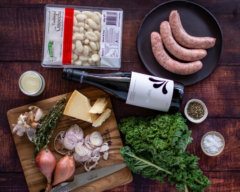 Pouring a glass of De Iuliis Sangiovese with a quick and easy gnocchi recipe